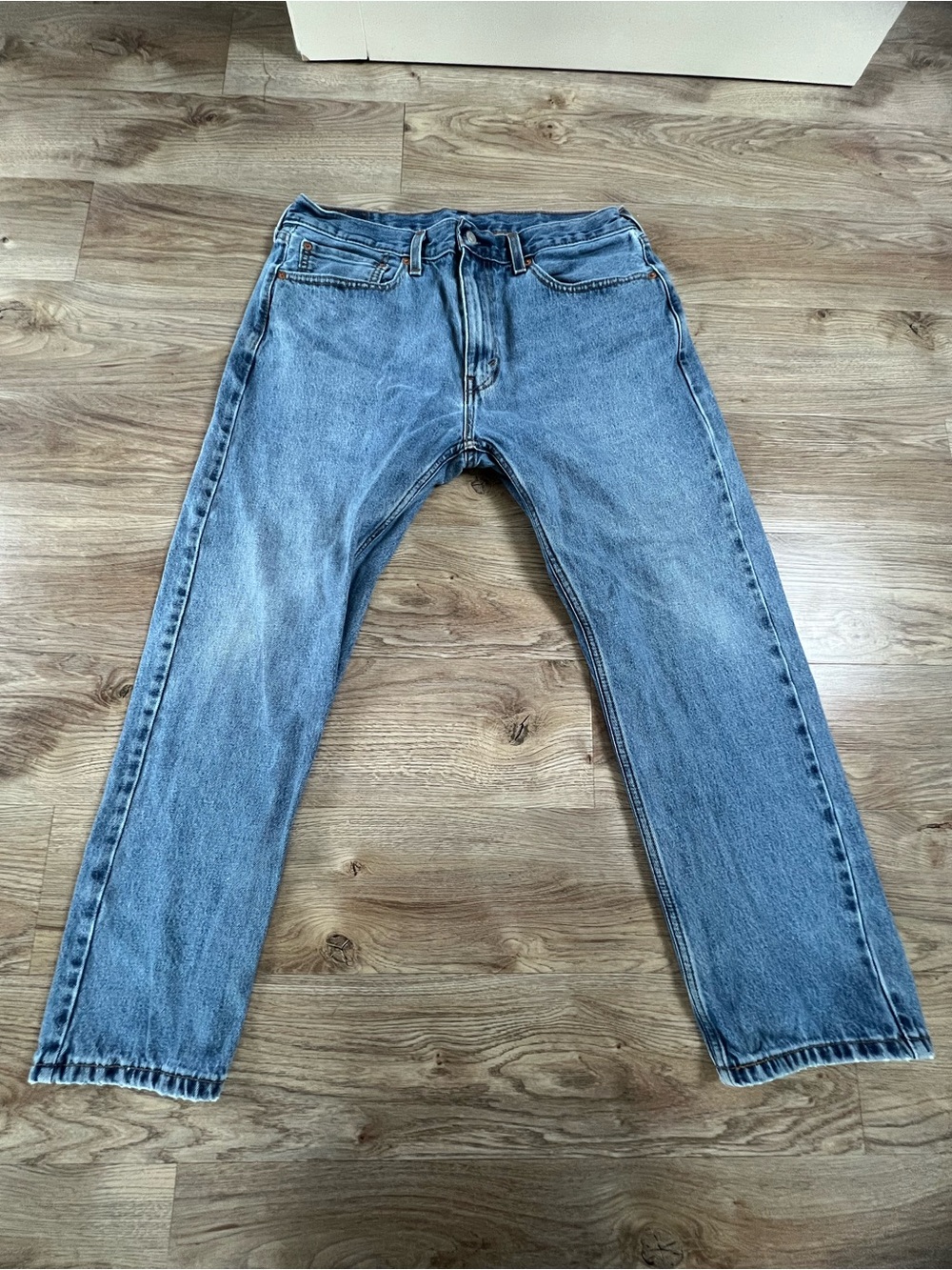 505 Levi's Men's Distressed Straight Jeans in Faded Blue Denim